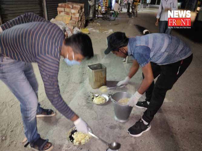 student of raiganj distribute food to animals | newsfront.co