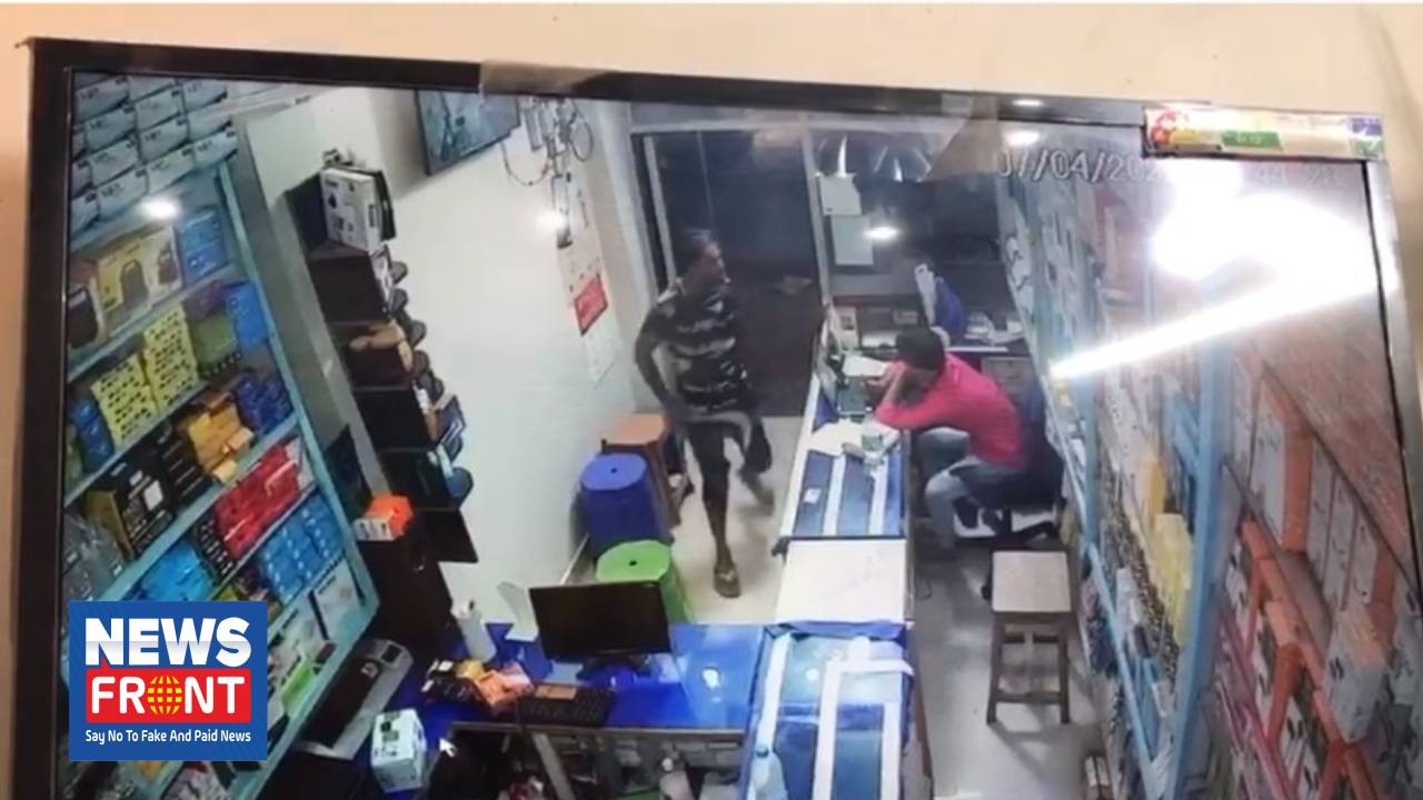 mobile store young man comes with sharp weapon 